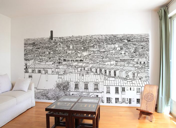 Un petit salon avec papier peint panoramique Tour Montparnasse et Concorde a Paris